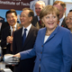 Image for article titled Why Is Angela Merkel Always Palling Around With Robots?